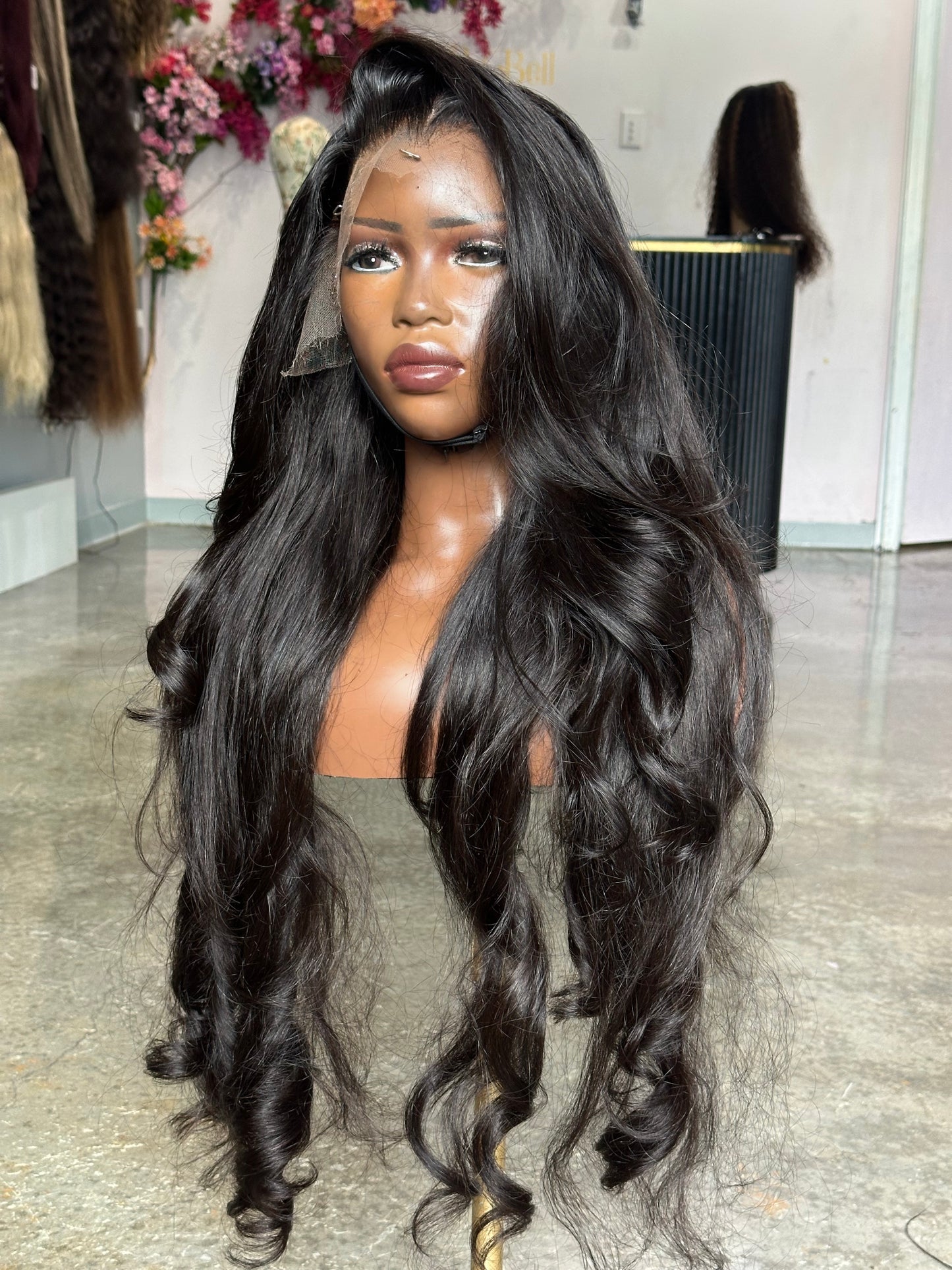 Right side view of virgin hair natural black color wig made with 3 bundles.