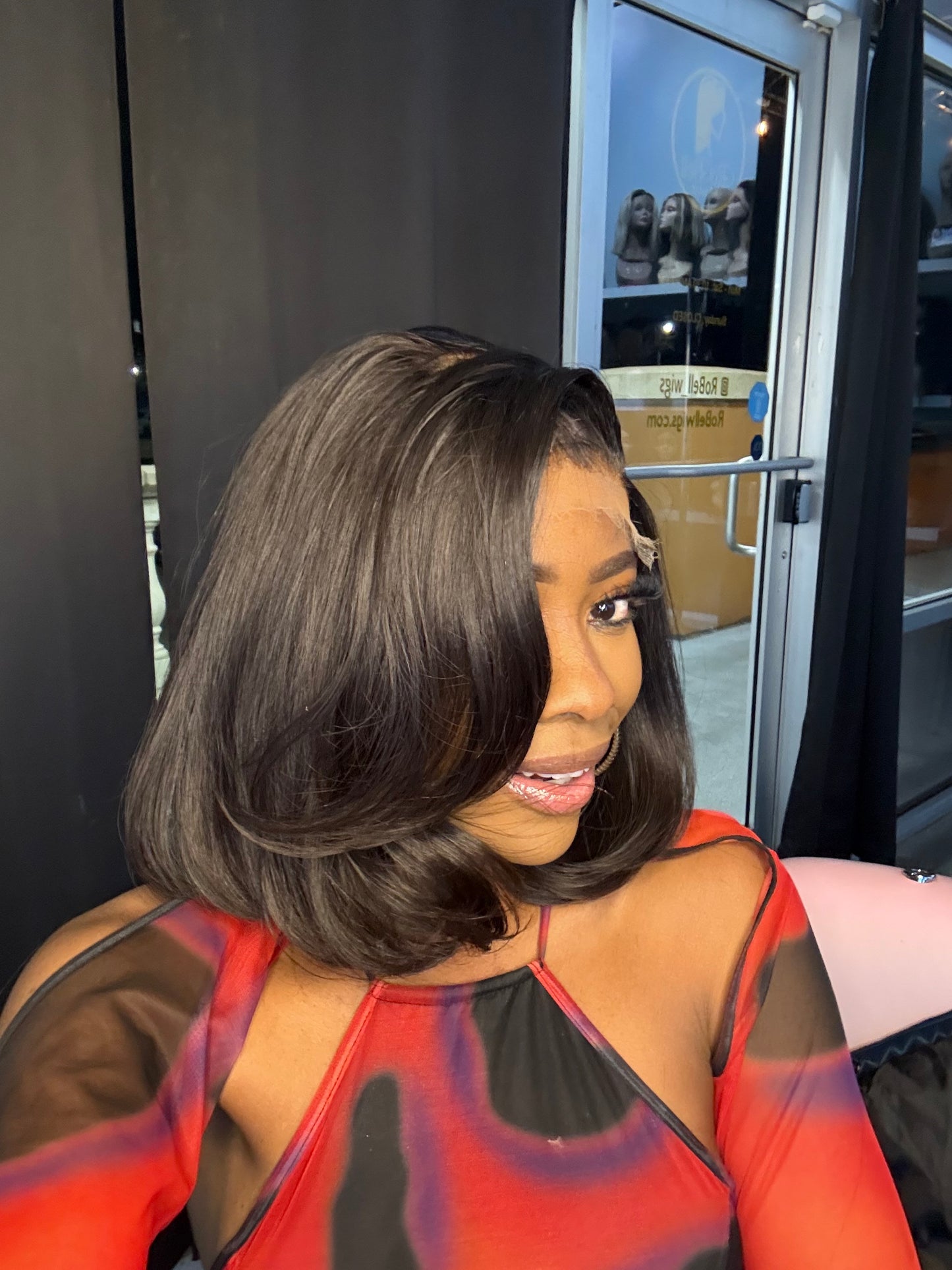 Short natural color wig; left quarter view.