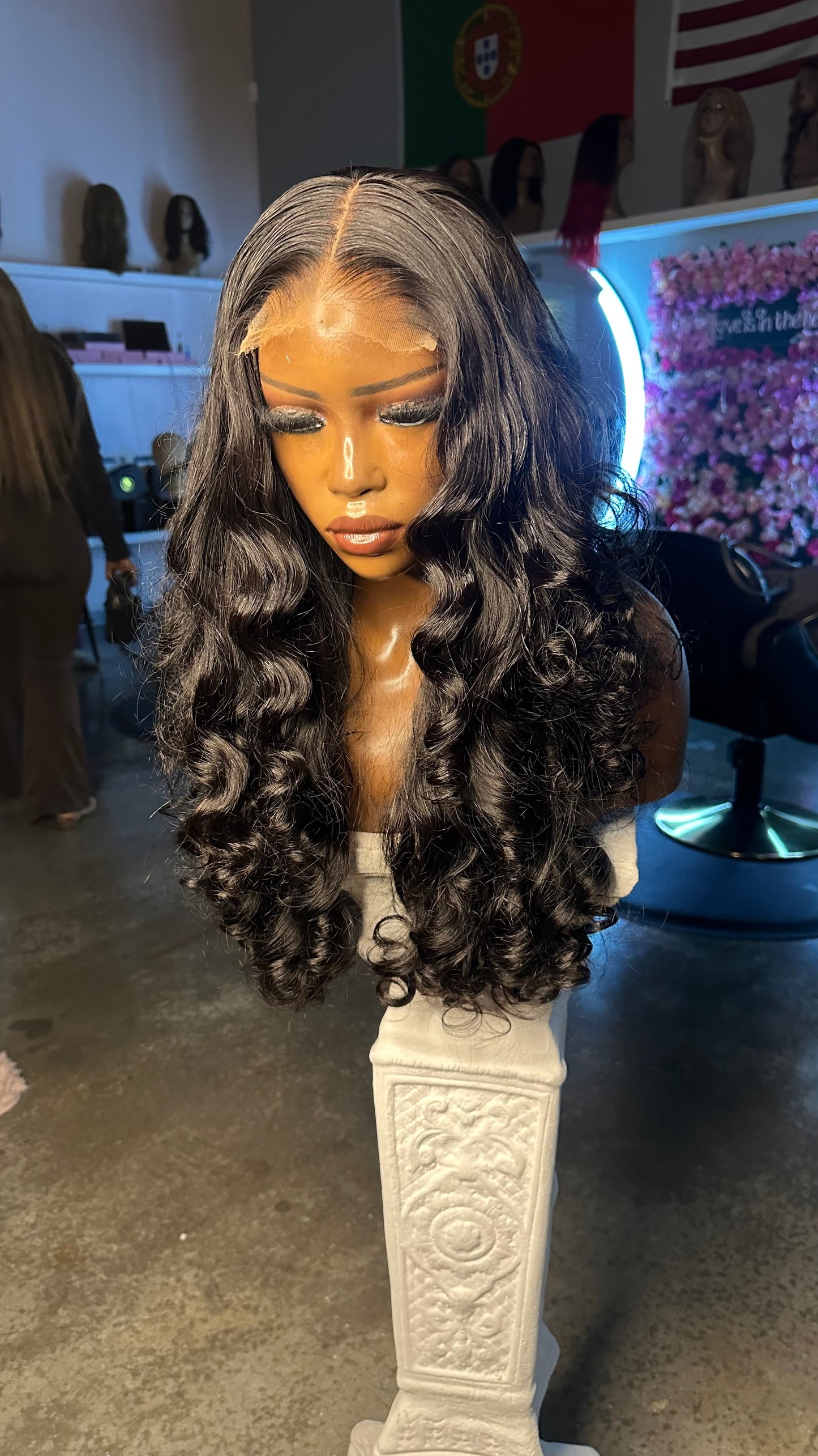 Natural color double drawn wig with egg curls; right quarter view on mannequin.