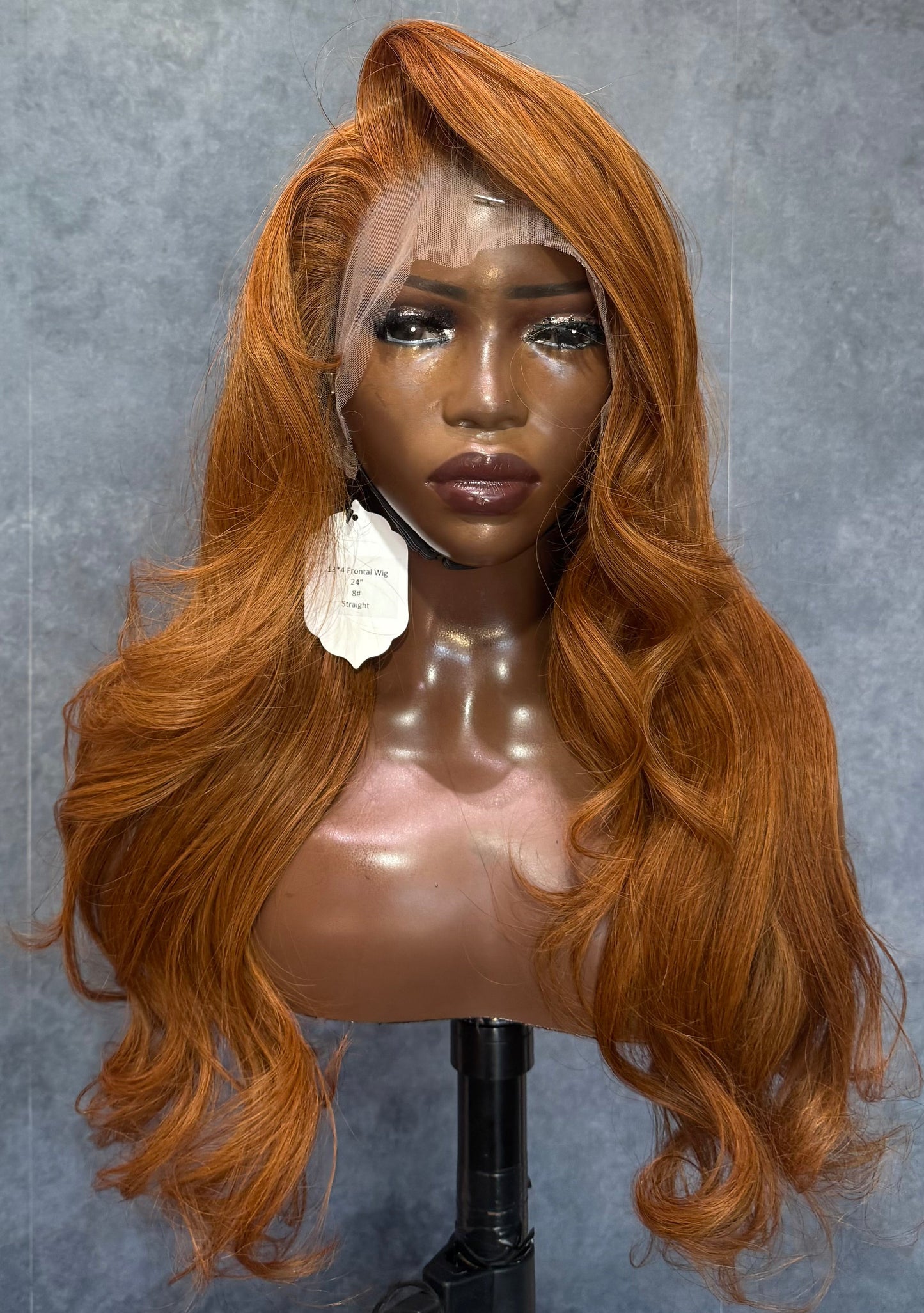 Copper colored wig with straight texture.