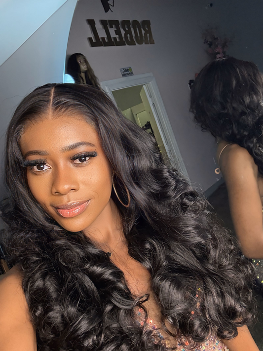 Natural color double drawn wig with egg curls; front view on model.