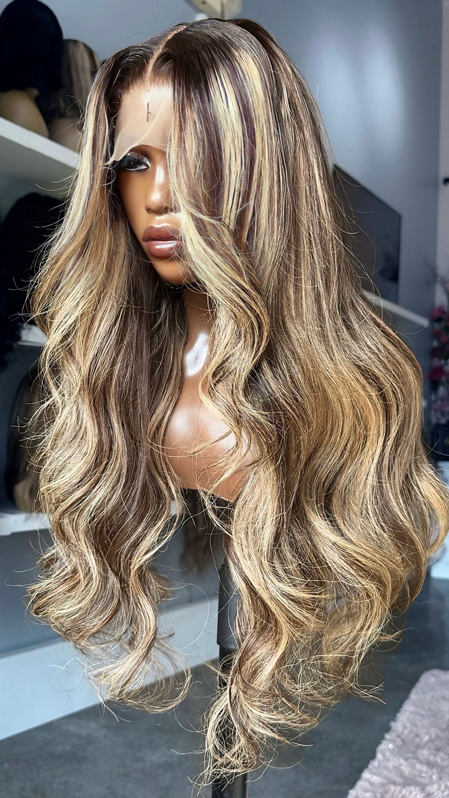 Long blonde wig with dark highlights.