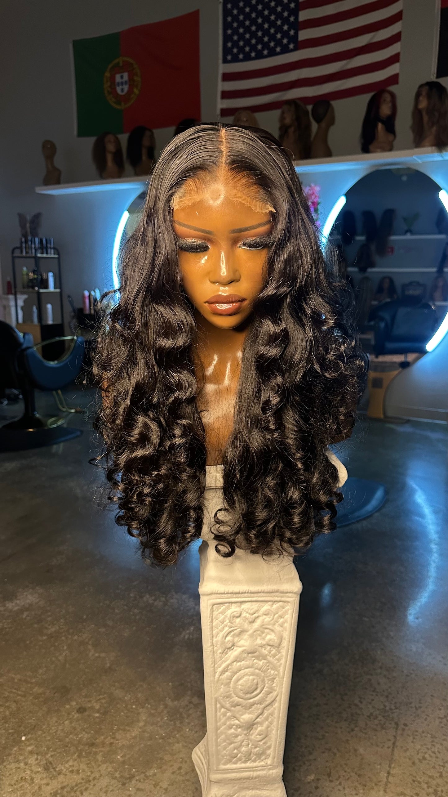 Natural color double drawn wig with egg curls; front view on mannequin.