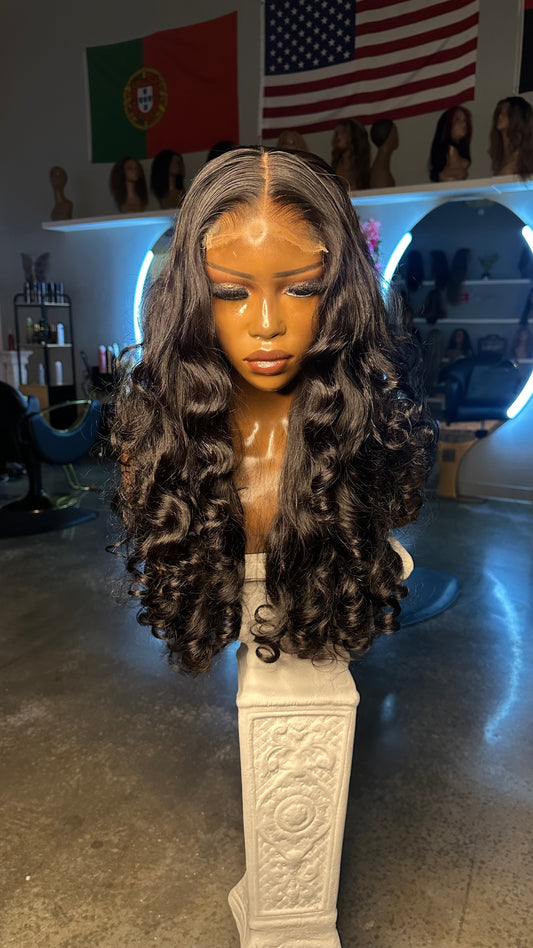 Natural color double drawn wig with egg curls; front view on mannequin.