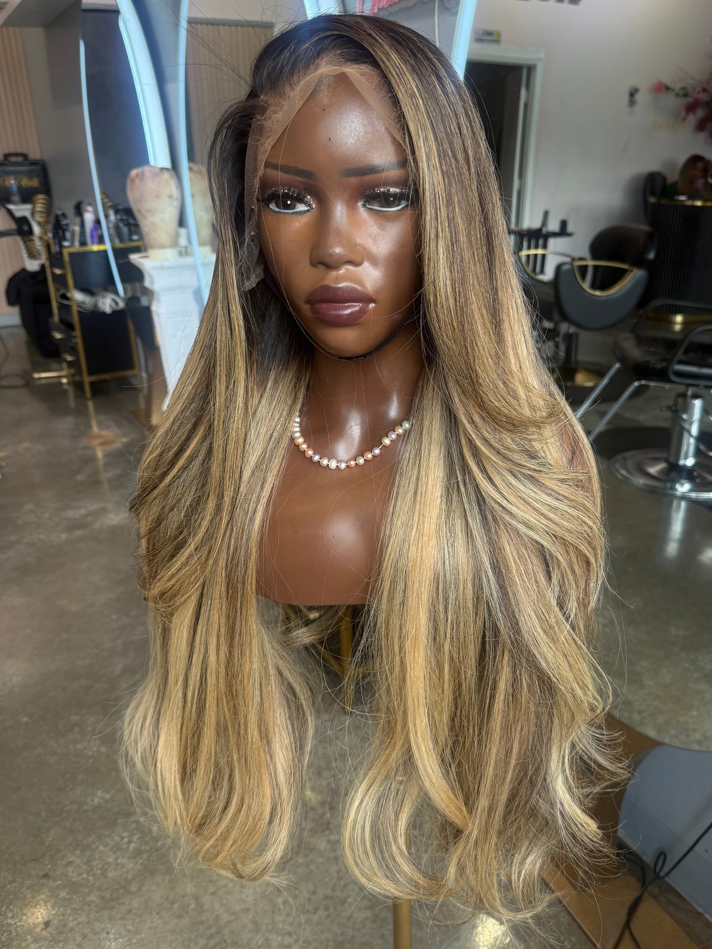 Front left-view of raw hair wig made with lace frontal 13x4 and highlighted colored bundles.