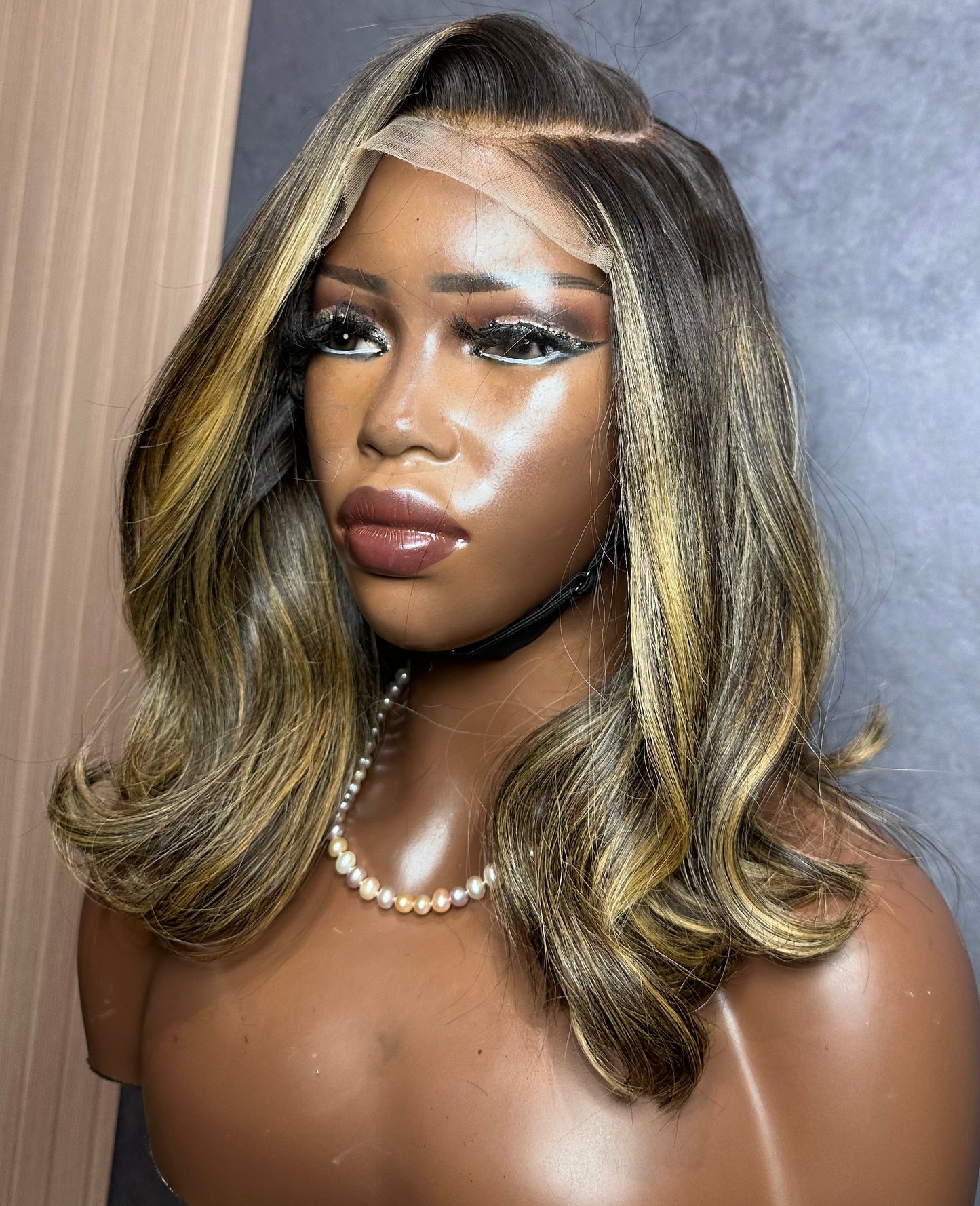 Left side view of closure wig made with 2 bundles of raw Vietnamese highlight hair.