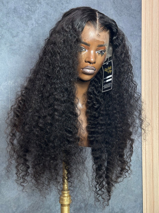 Front right view of natural black color deep wave wig.