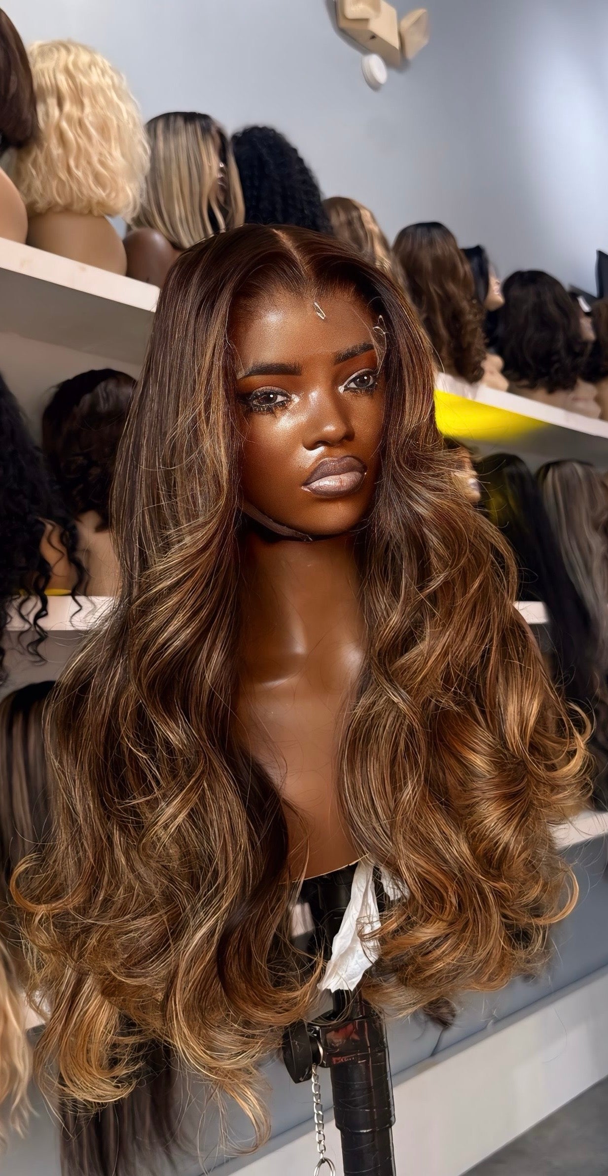 Human hair wig with brown balayage highlights and an HD lace frontal; front view.