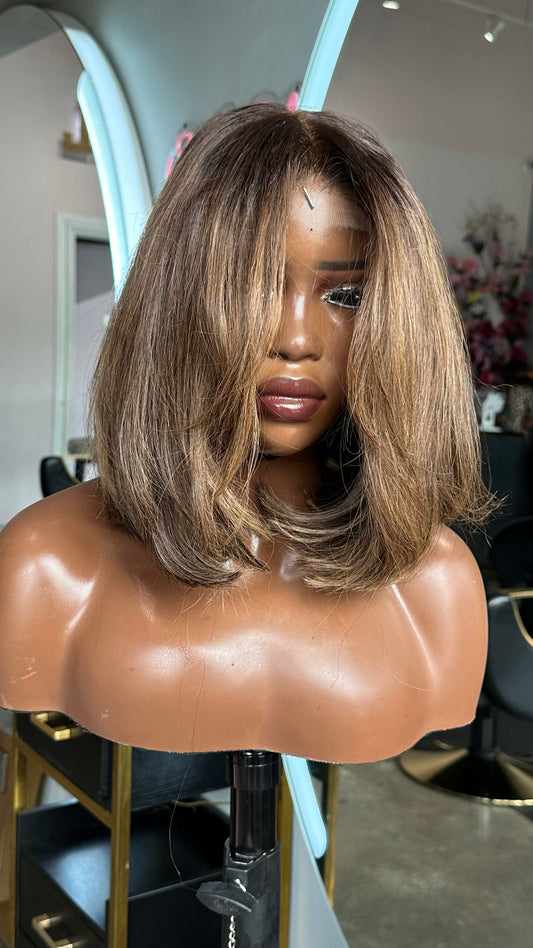 Brown bob wig with a lace closure.