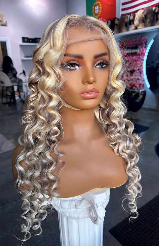 Blonde color wig with grey highlights; front left view.