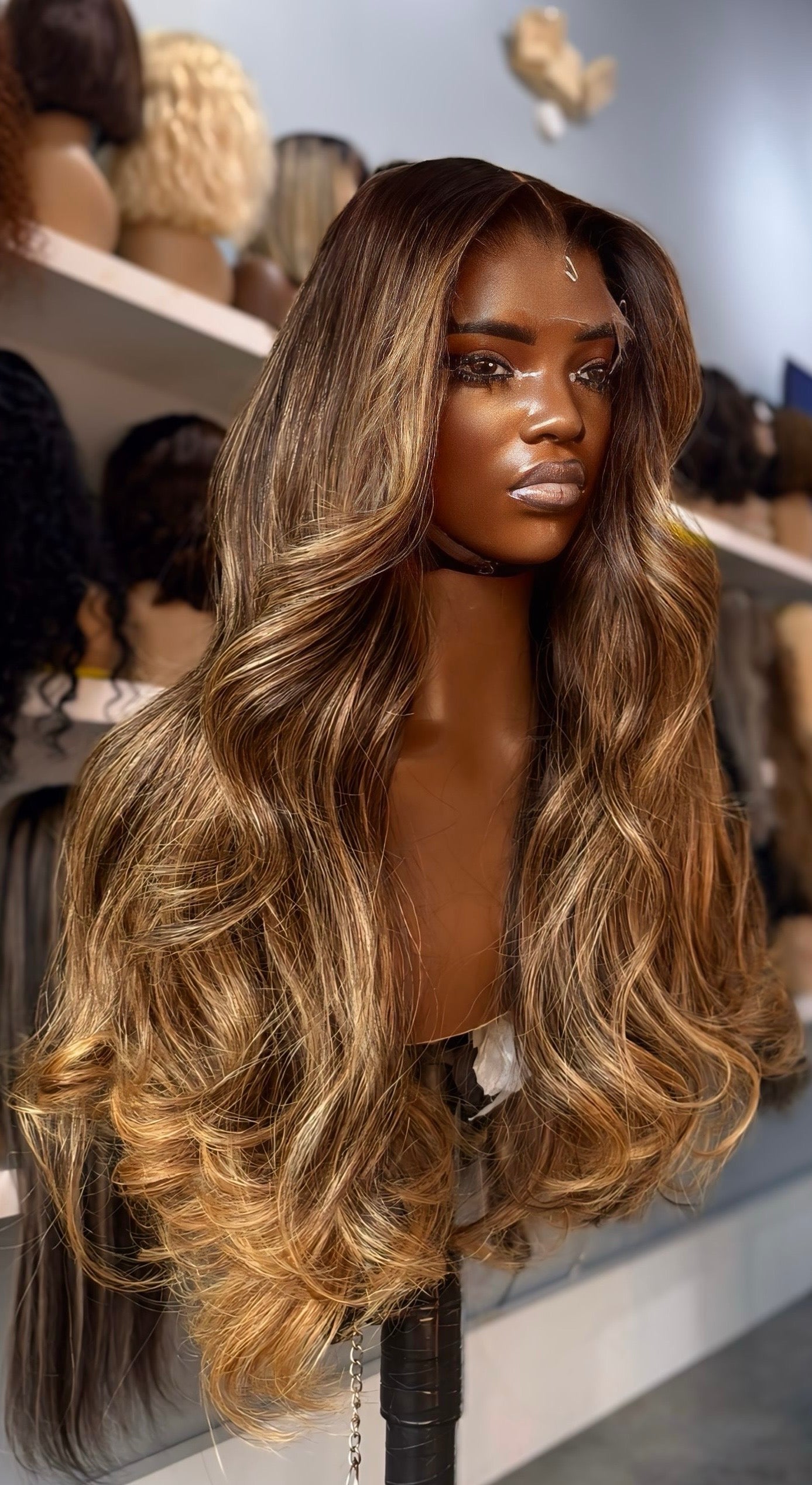 Human hair wig with brown balayage highlights and an HD lace frontal; front quarter view.