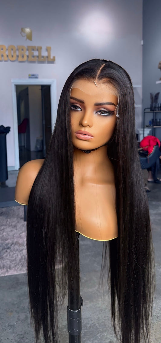 Human hair wig in a natural color with a straight texture.