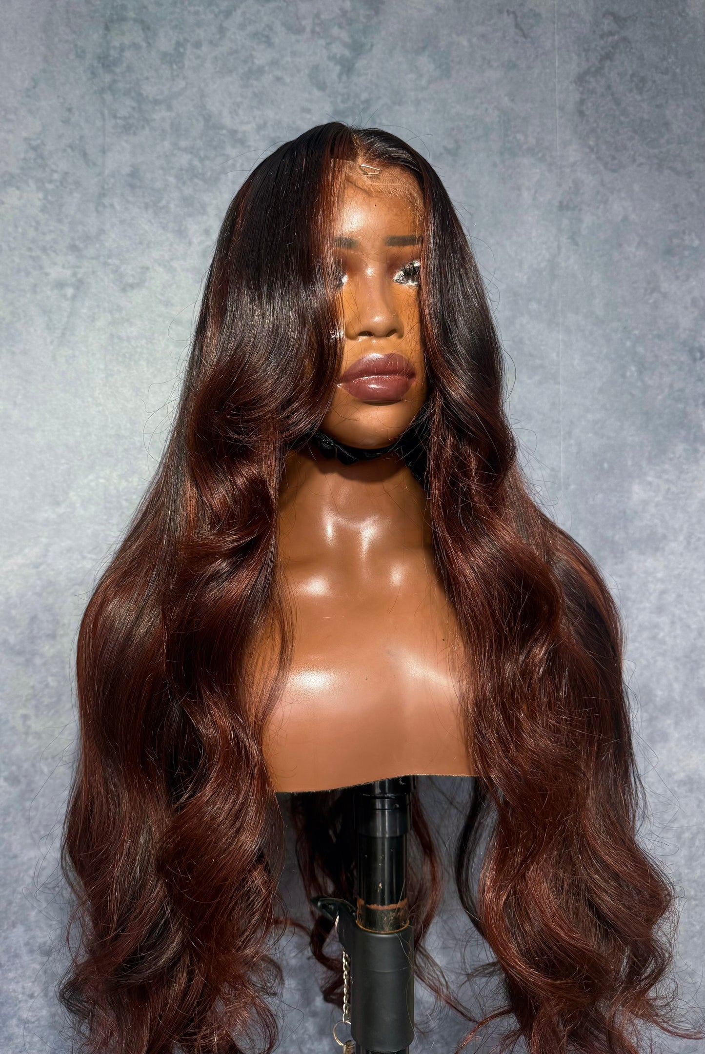 Dark copper wig with black highlights.
