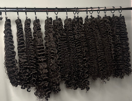 Burmese curly hair bundles in a natural color.