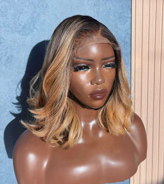 Raw lace closure wig with highlights.