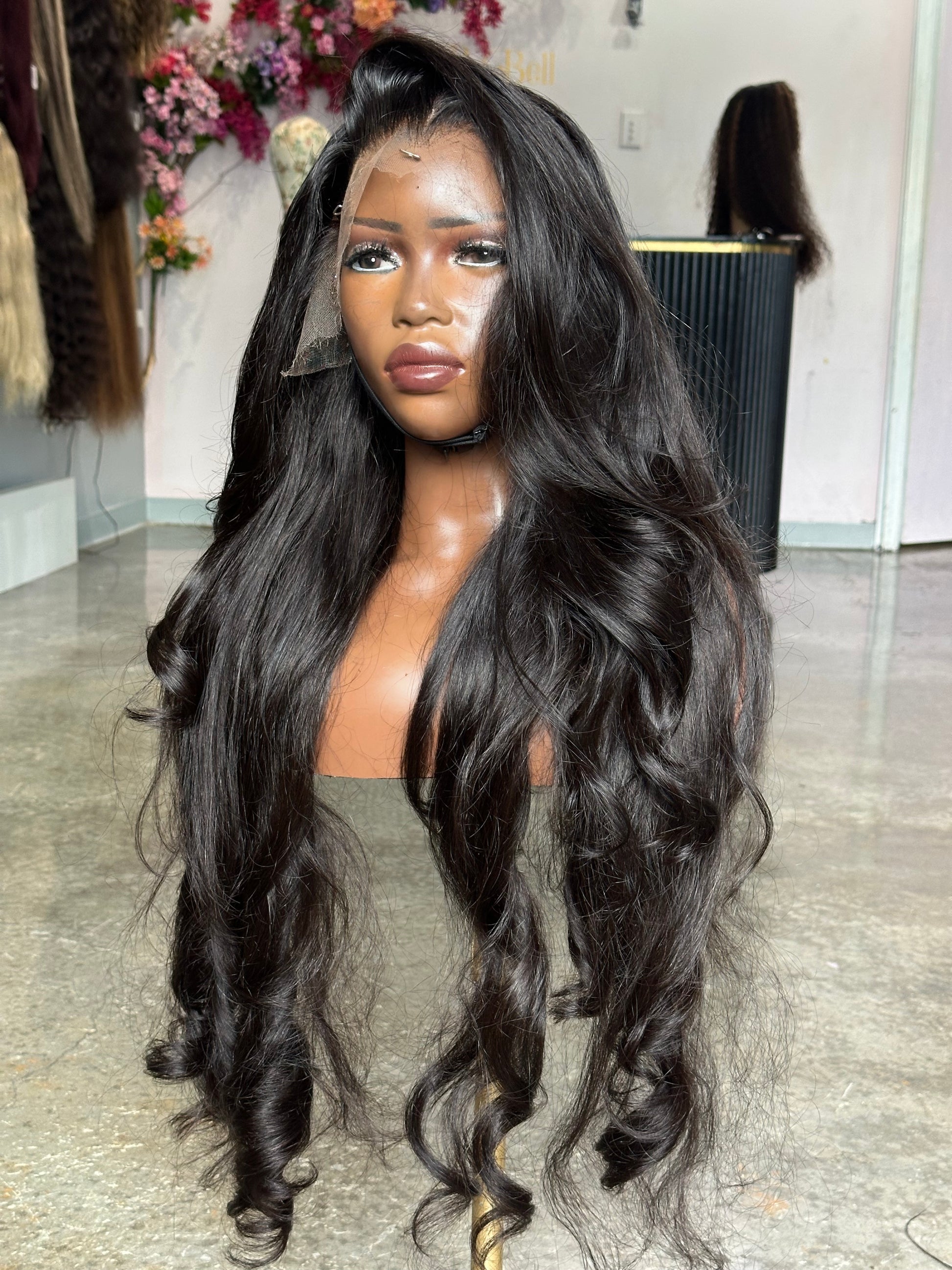 Right side view of virgin hair natural black color wig made with 3 bundles.
