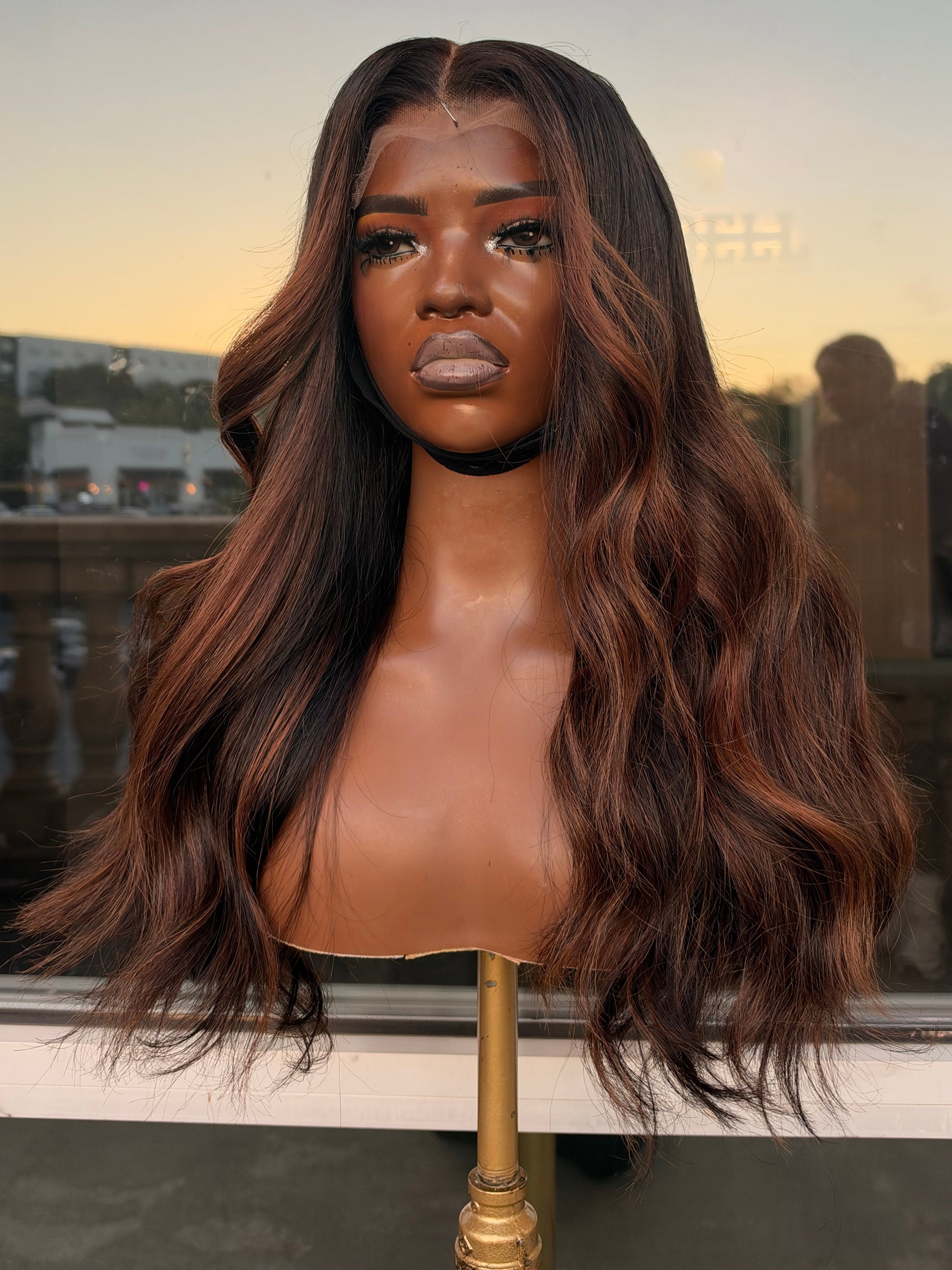 Ultra Virgin 20” long wig with chocolate and highlight colors.