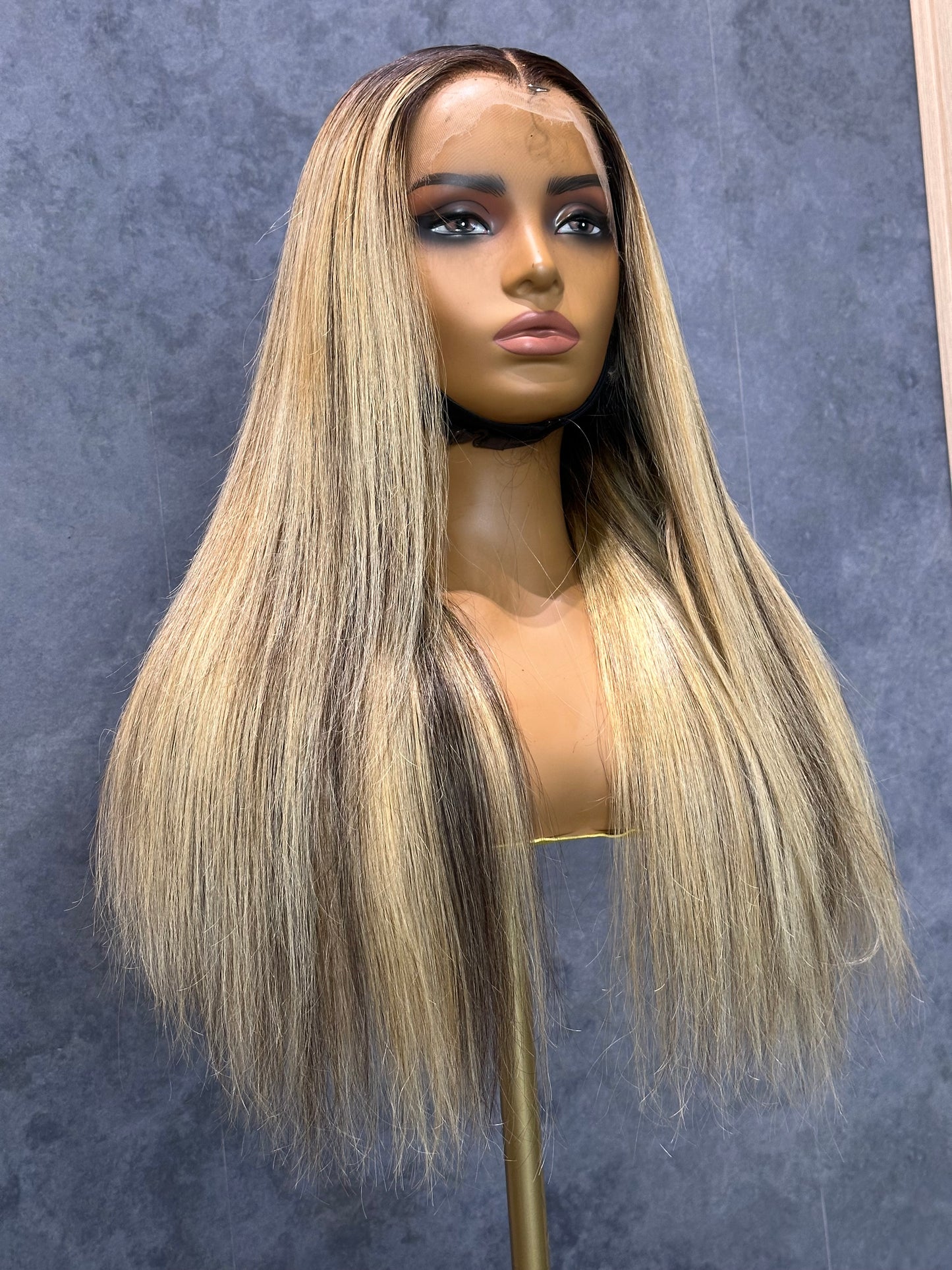 Lower-front right view of HD lace frontal 13X4 wig with mixed highlights.