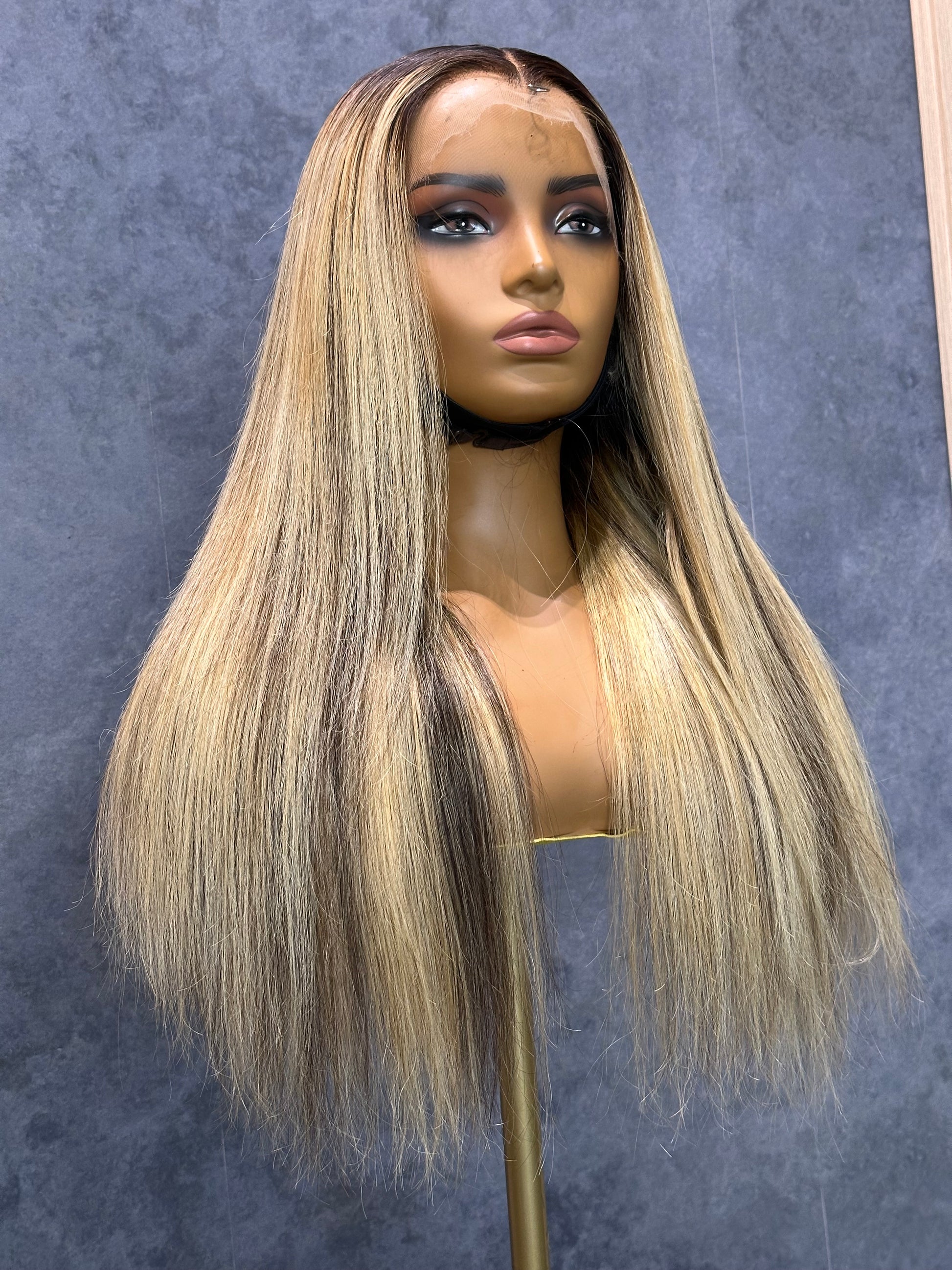 Lower-front right view of HD lace frontal 13X4 wig with mixed highlights.