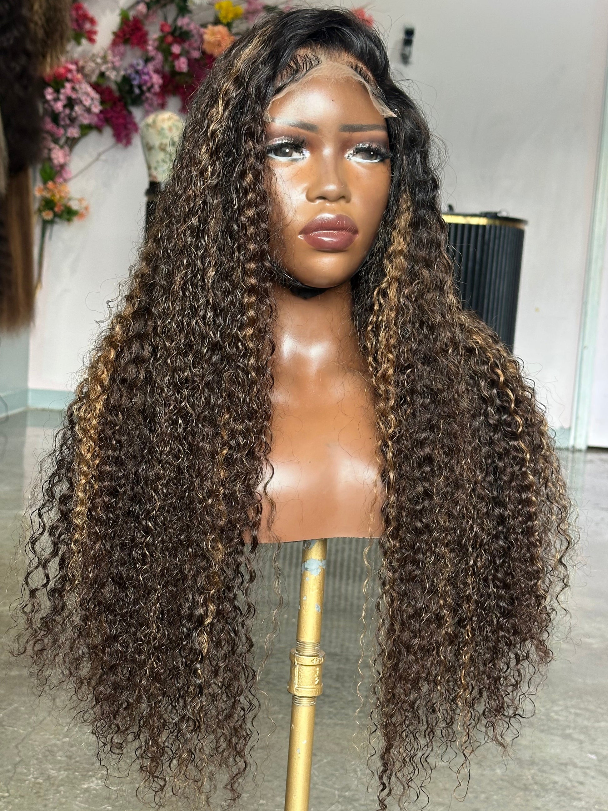 Left side view of Virgin human hair wig with highlights and a lace closure 5X5.
