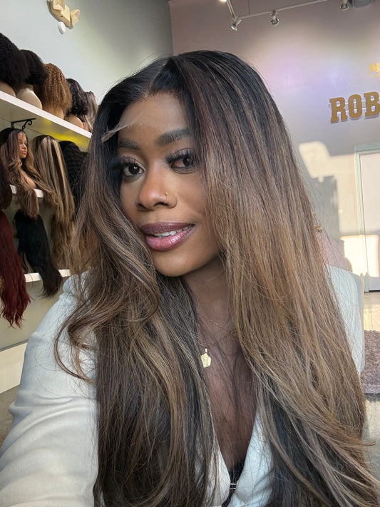 Front right view of raw hair wig showing brown highlights.