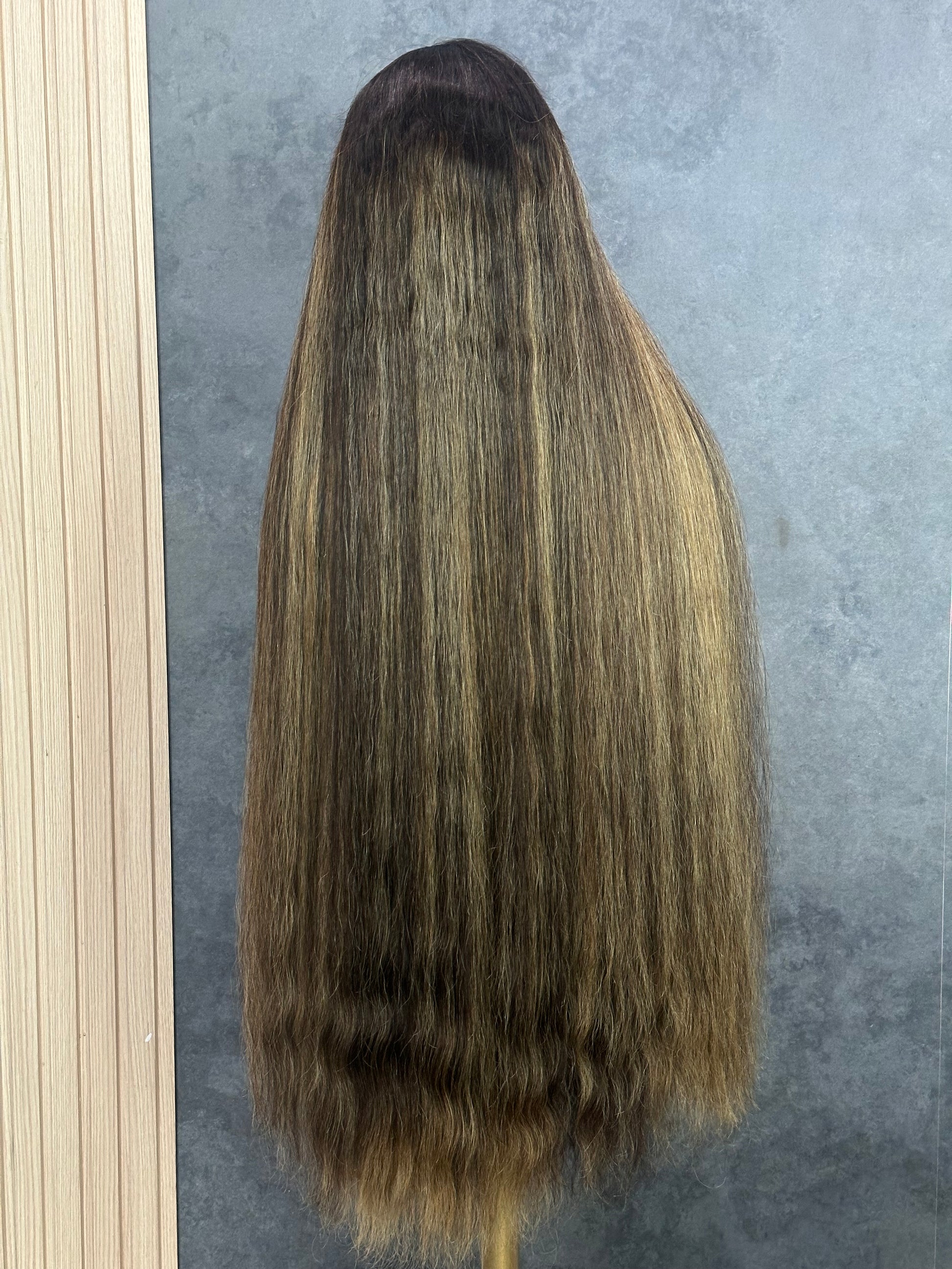 Rear view of the custom highlight color on 36” closure wig.