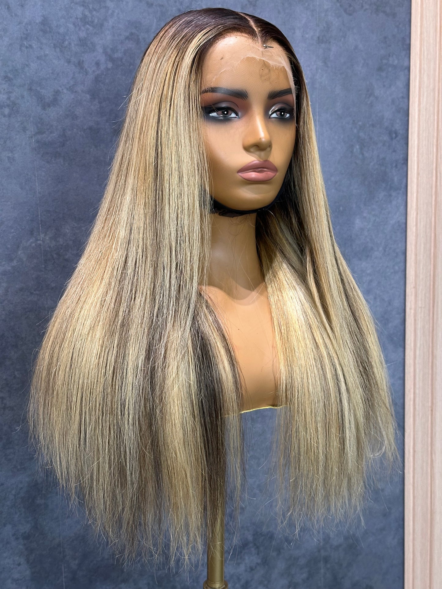 Front-right view of blonde highlight wig made with a lace frontal 13x4.