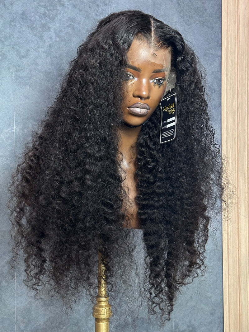 Front right view of natural black color deep wave wig.
