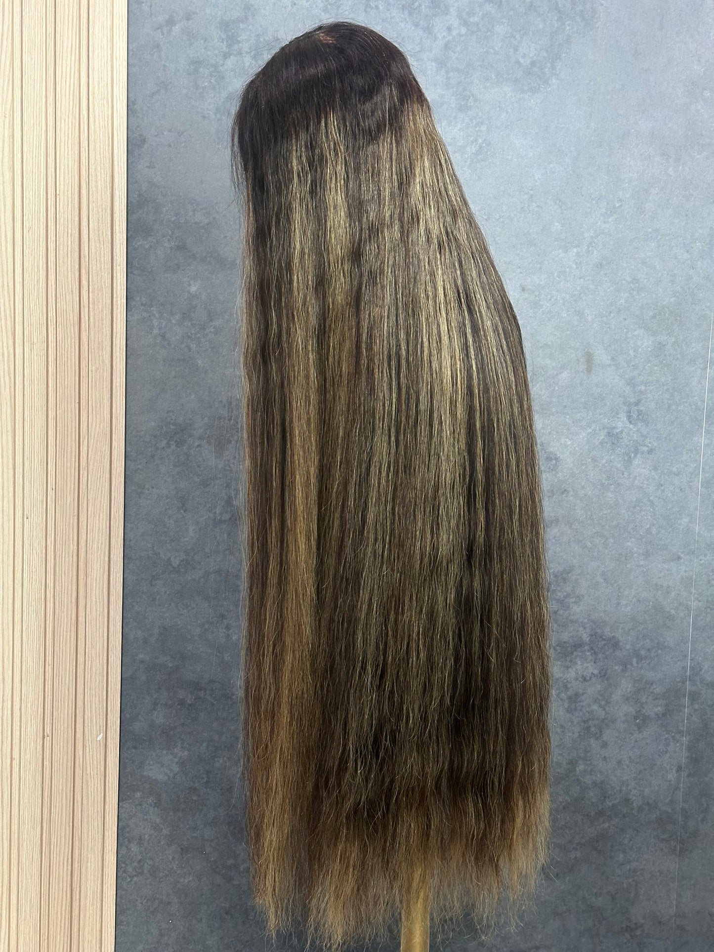 Left side view of 36” raw Vietnamese wig showing the highlight colors.