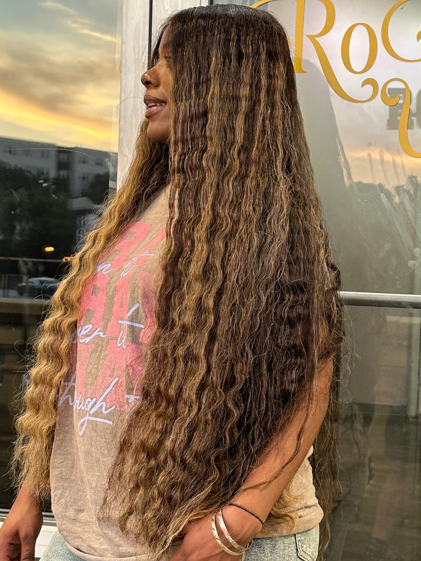 Left side view of raw Vietnamese wig with highlights. 