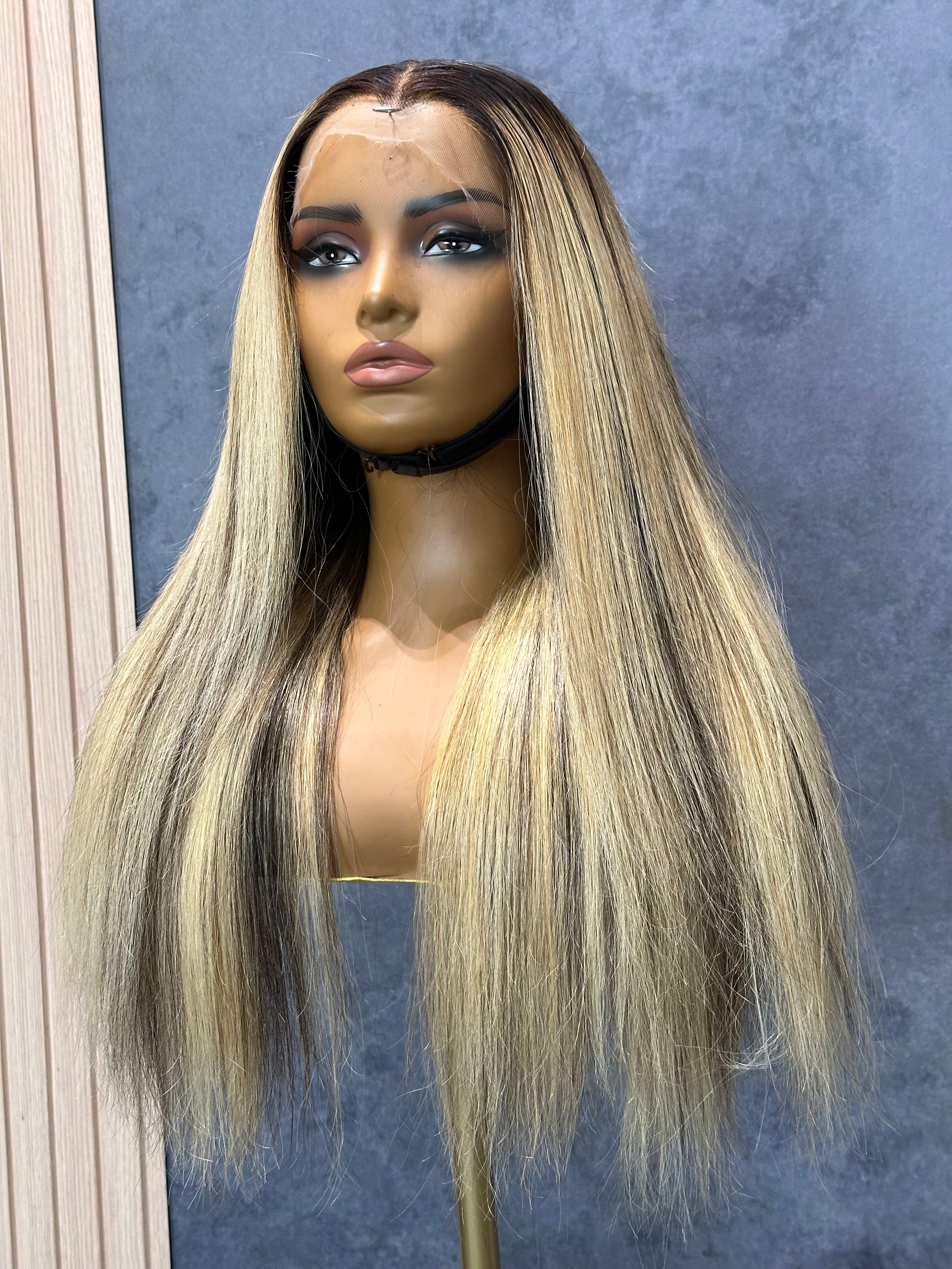 Lower-left view of double-drawn raw hair wig with natural colors roots.
