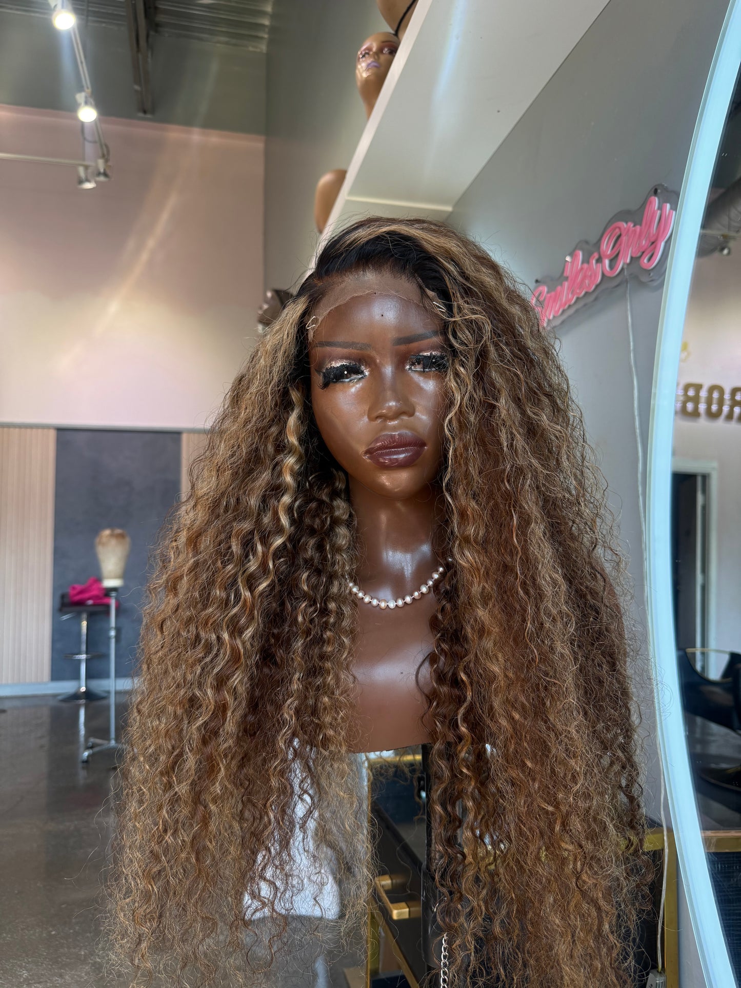 Mannequin head with long braided hair in a store setting