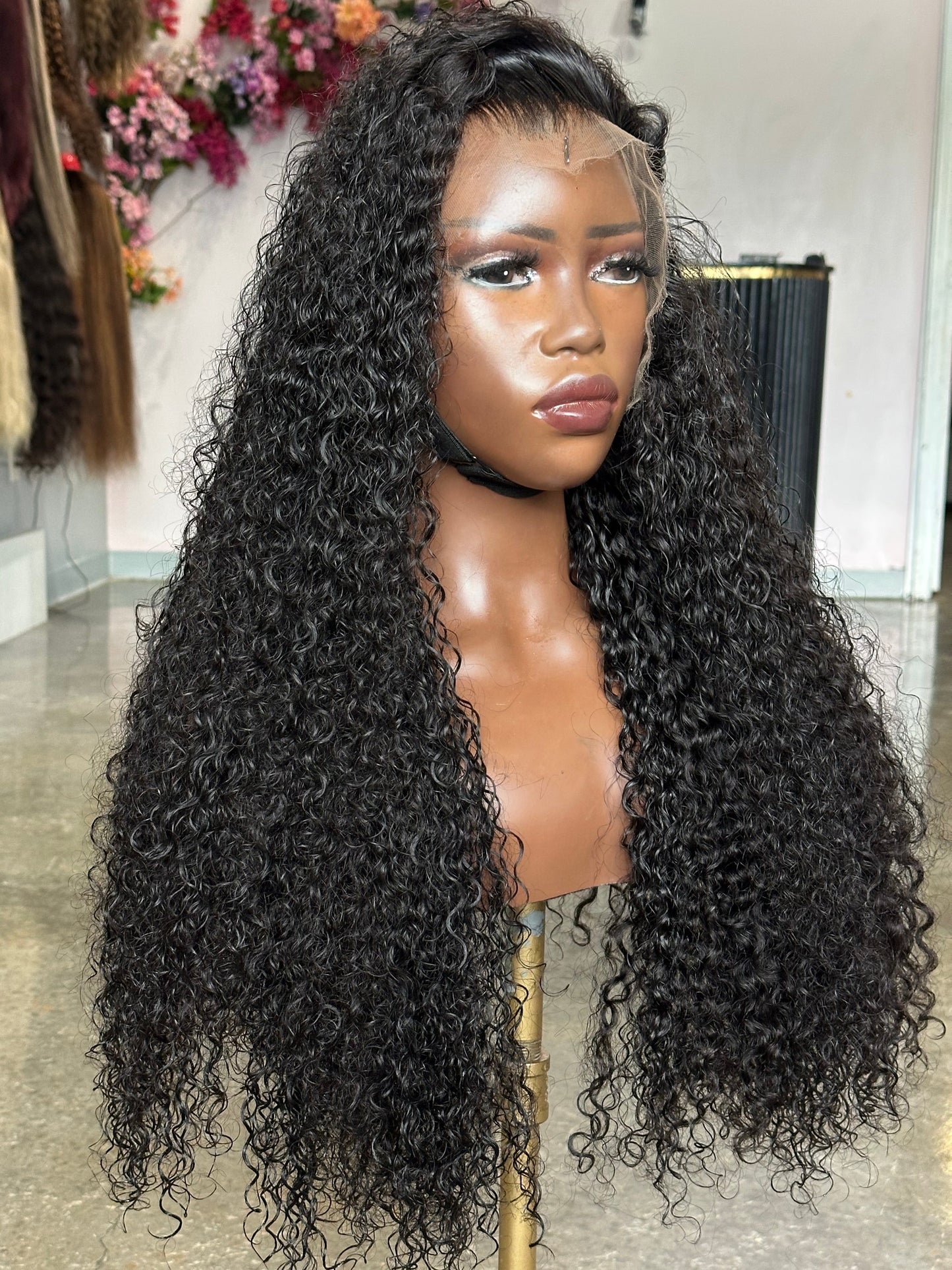 Left side view of lace frontal wig made with 3 bundles and a curly texture.