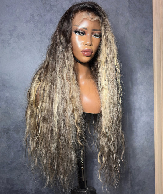 Raw Indian hair, body wave texture, with custom highlights.