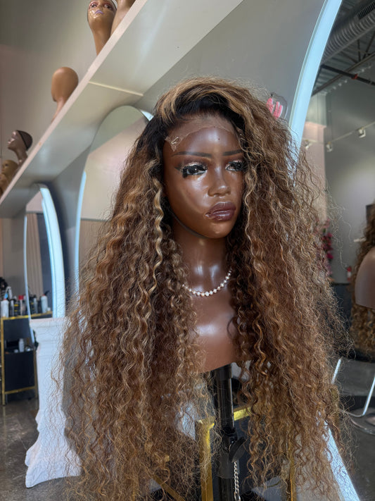 Mannequin head with long, wavy hair in a store setting