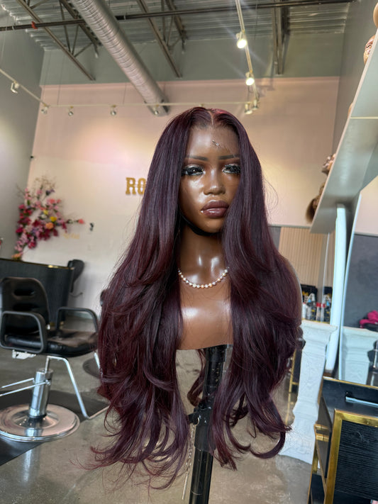 Front view of dark burgundy wig.