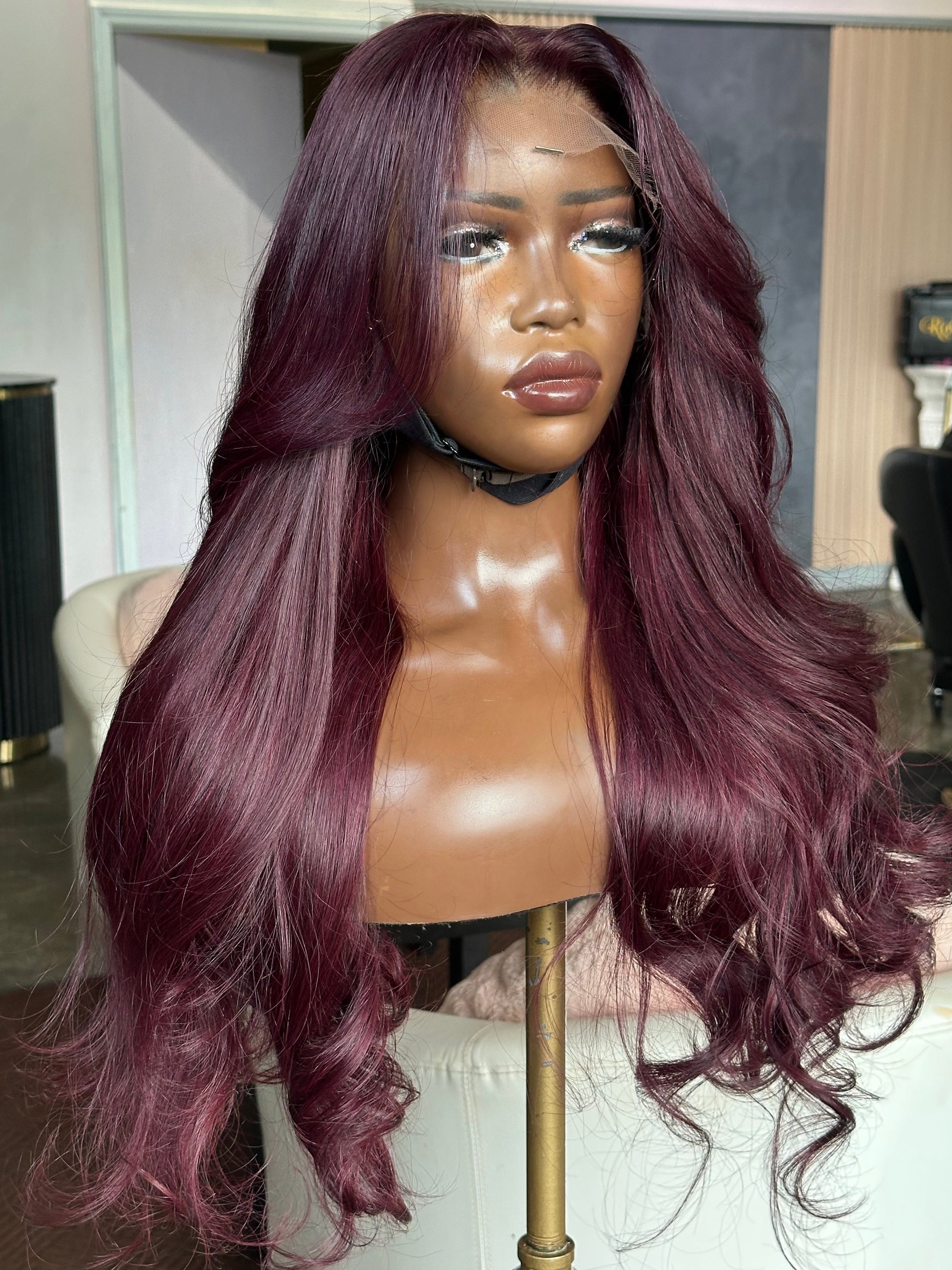 Front right view of body wave texture dark violet wig.