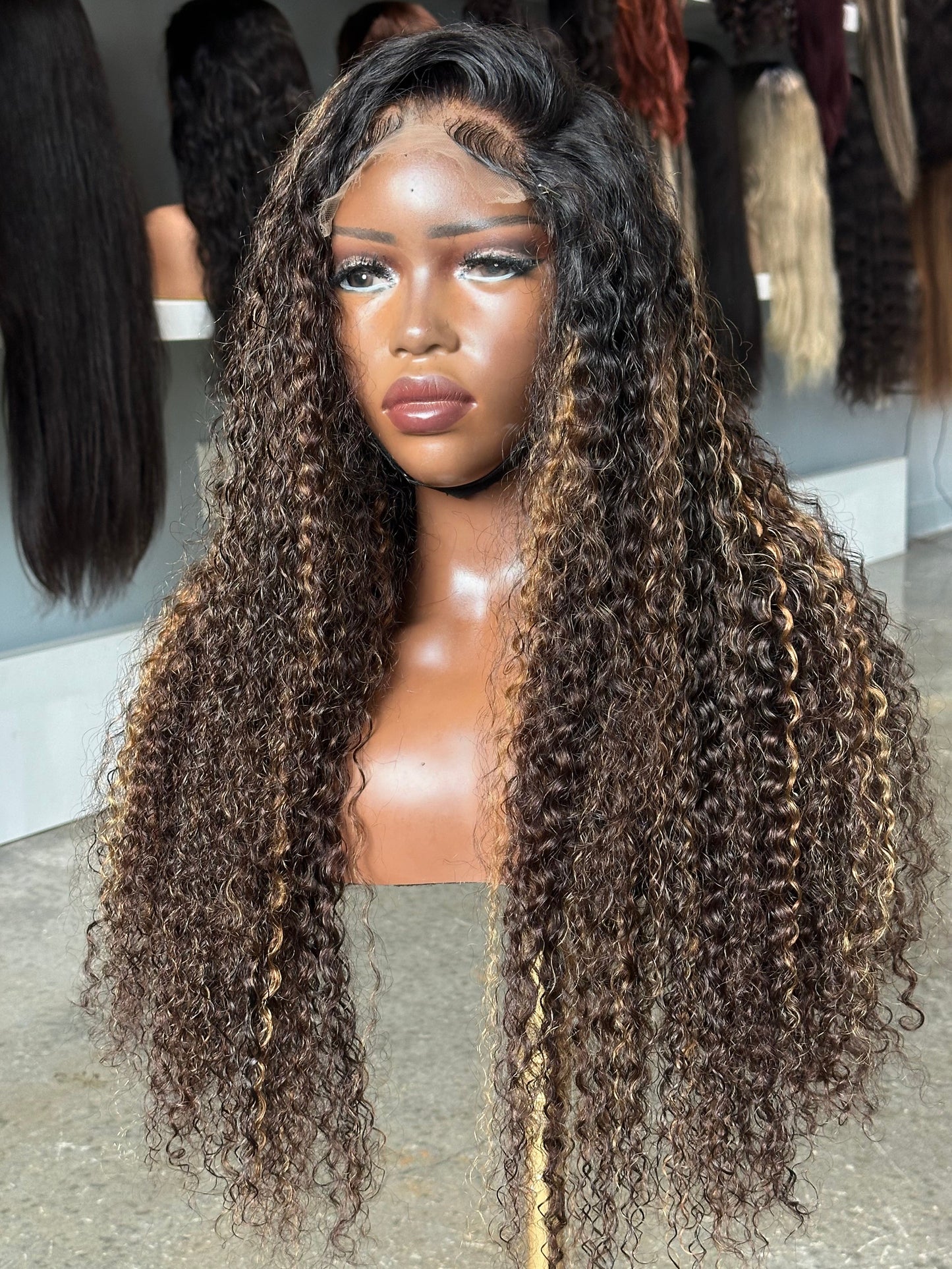 Right side view of deep curly highlight wig made with 2.5 bundles.