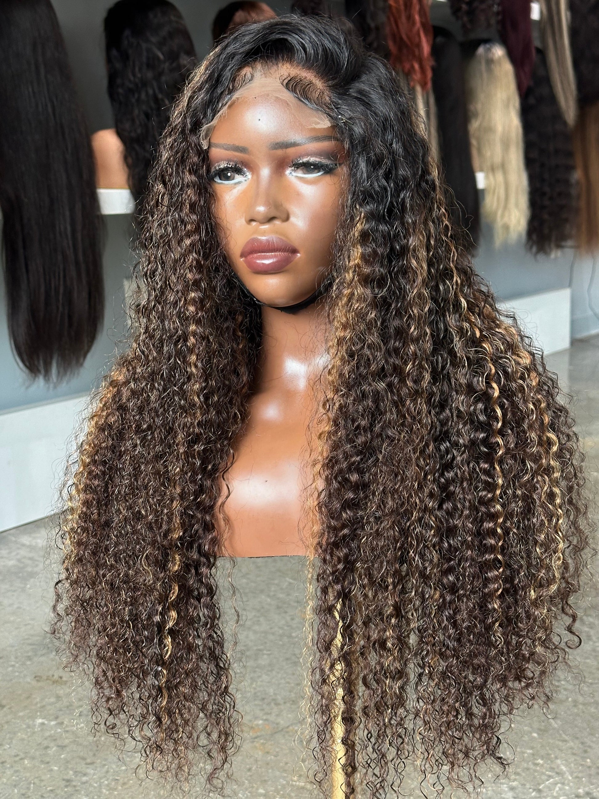 Right side view of deep curly highlight wig made with 2.5 bundles.