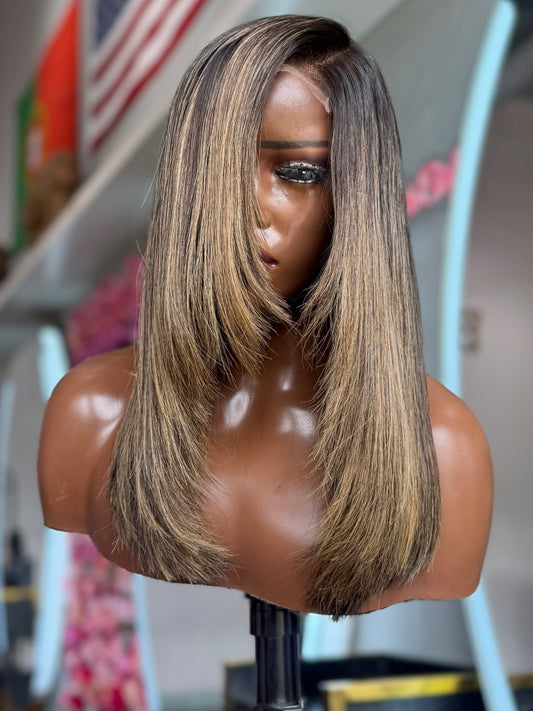 Closure Bob wig with blonde and grey colors.